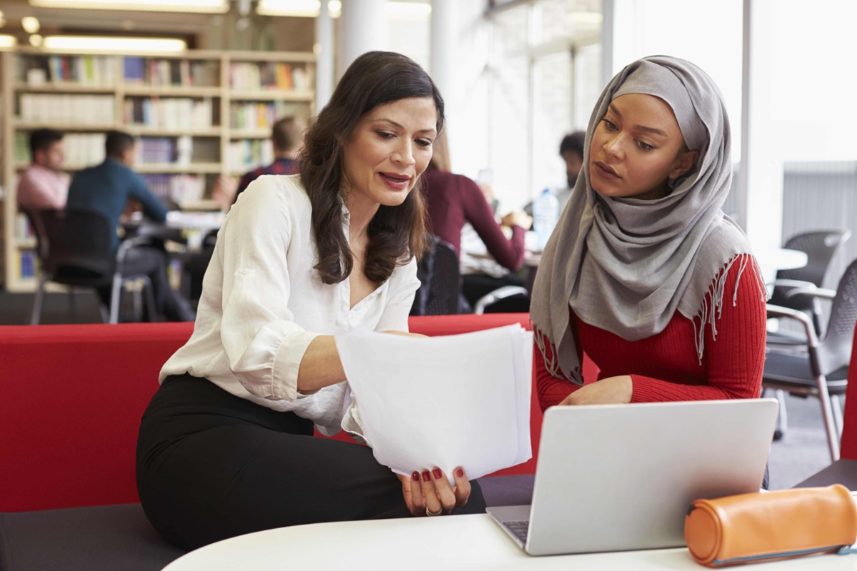 Two colleagues assessing documents