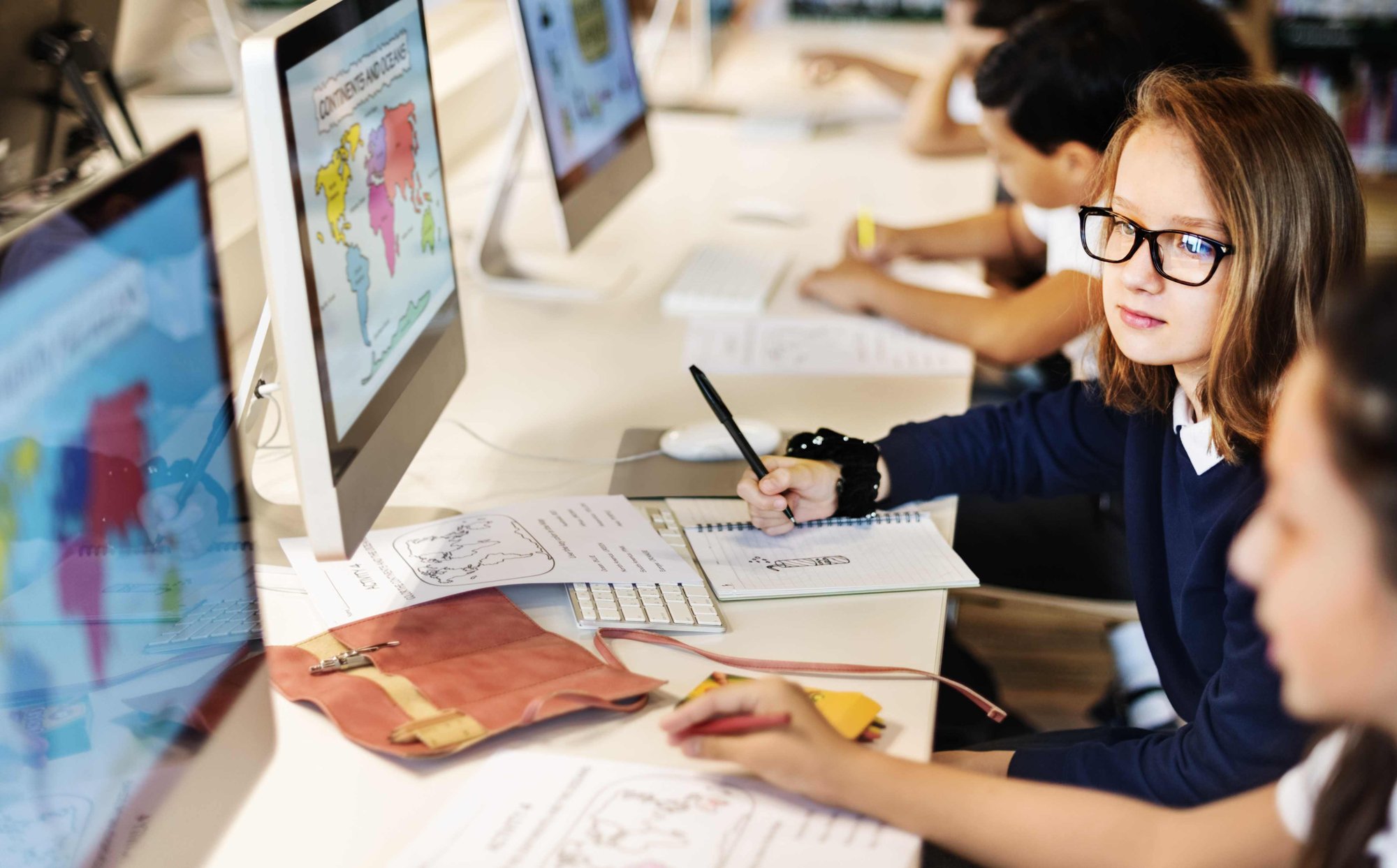 School pupils working together at computers