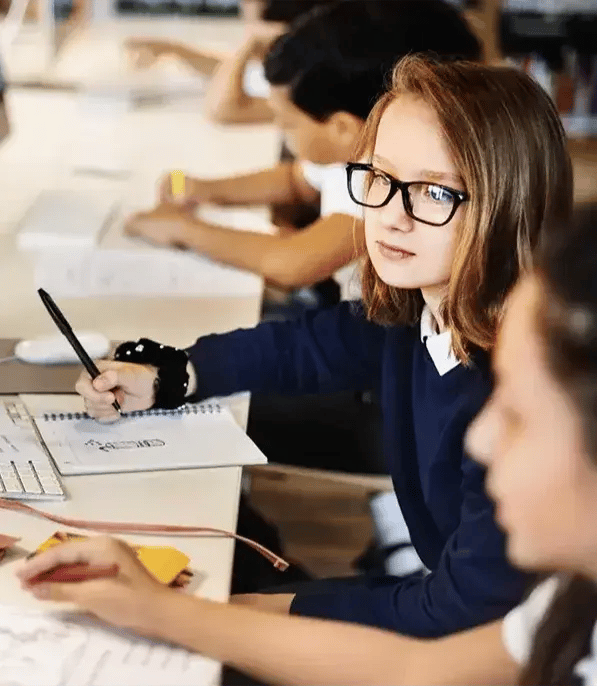 School pupils working together at computers1100-1