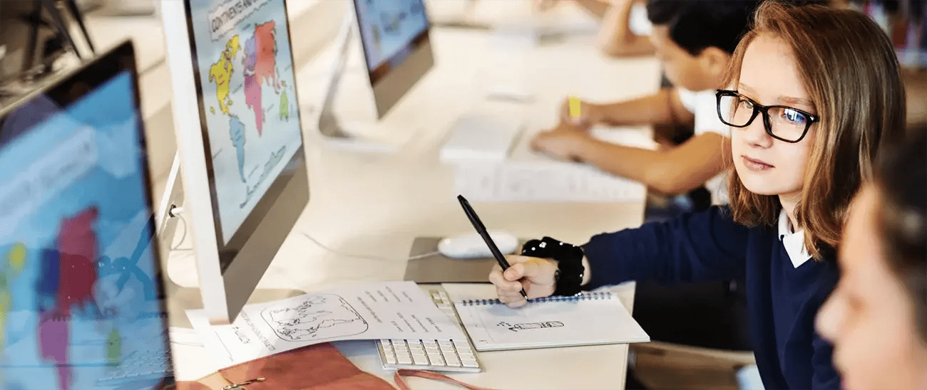School pupils working together at computers1300