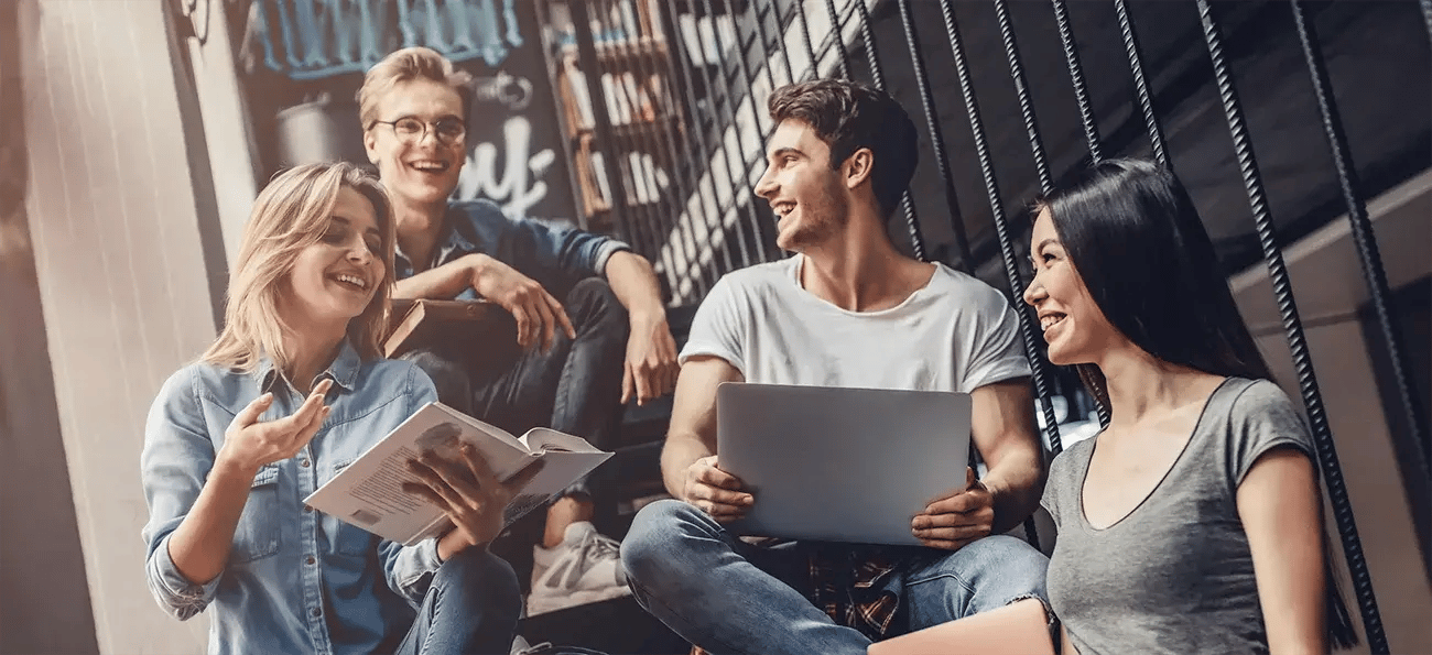 Student group sitting in stairwell with studies_1300