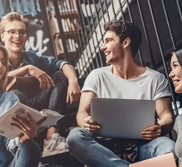 Student group sitting in stairwell with studies_mobile600